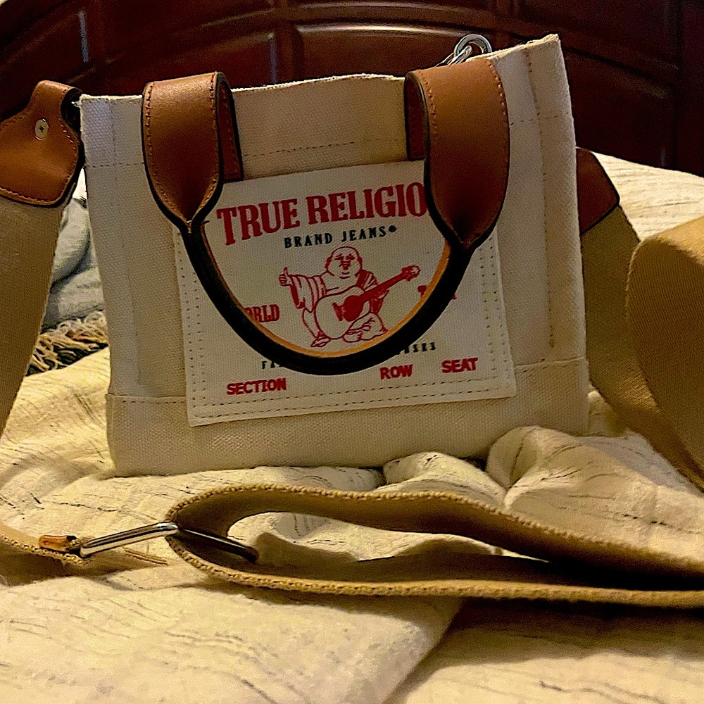 True Religion Mini Crossbody Bag is in perfect condition, and hangs just right.